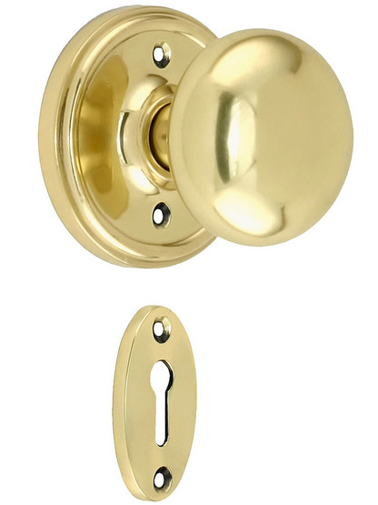 Classic Rosette Mortise Lock Set with Round Brass Knobs in Polished Brass.